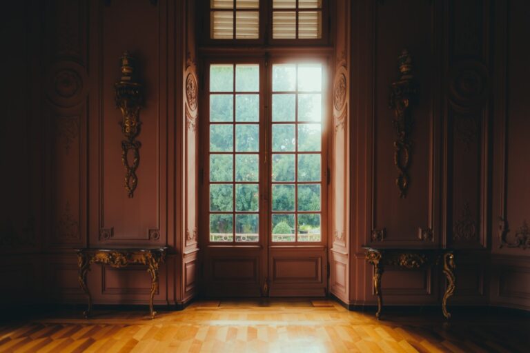 Beautiful hall in victorian style in Benrath castle pink walls and big door with window view on the garden